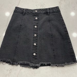 Black snap front denim skirt